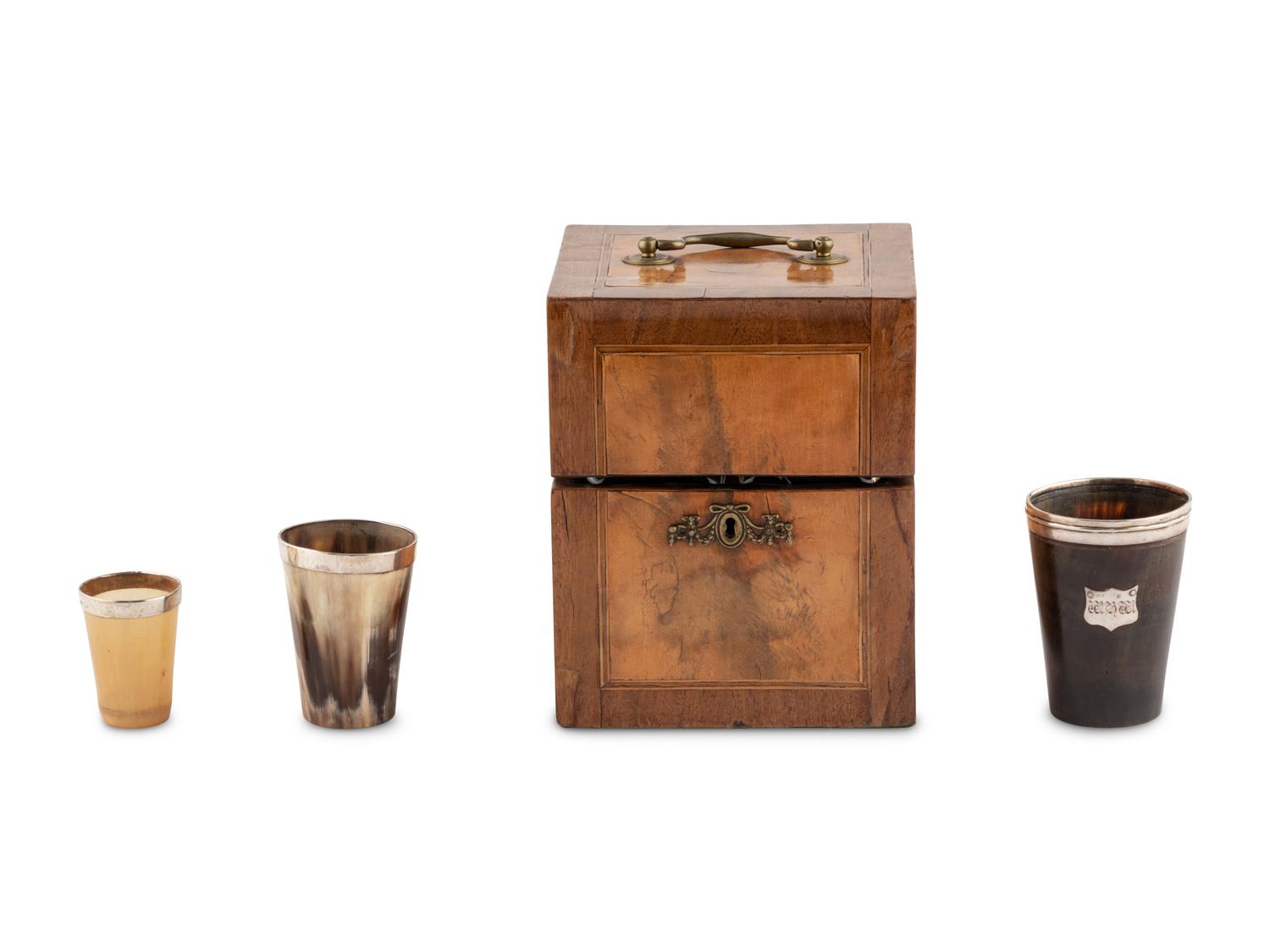 A Walnut and Mahogany Tantalus and Three Silver-Mounted Horn Tumblers