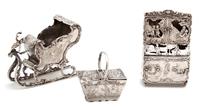Three Continental Silver Ornaments, Possibly German, 19th Century, comprising a sleigh, a cabinet, and a basket