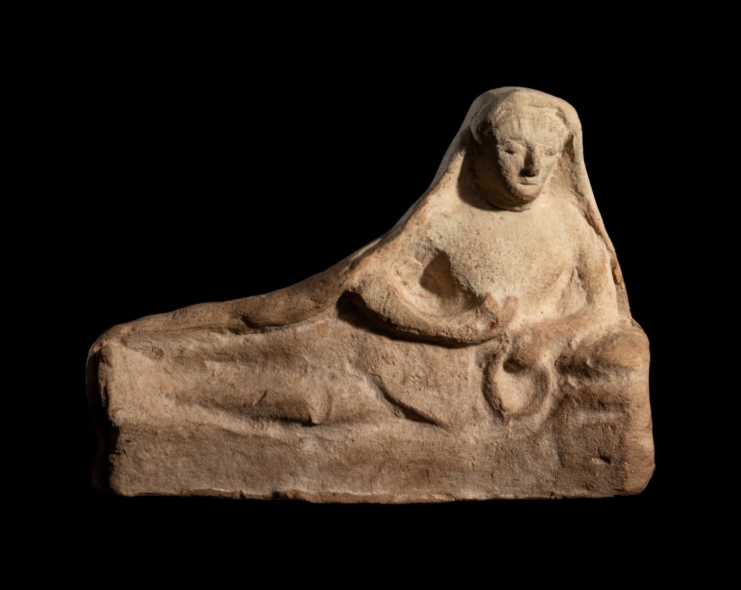 A Greek Terracotta Reclining Figure