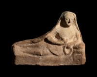 A Greek Terracotta Reclining Figure