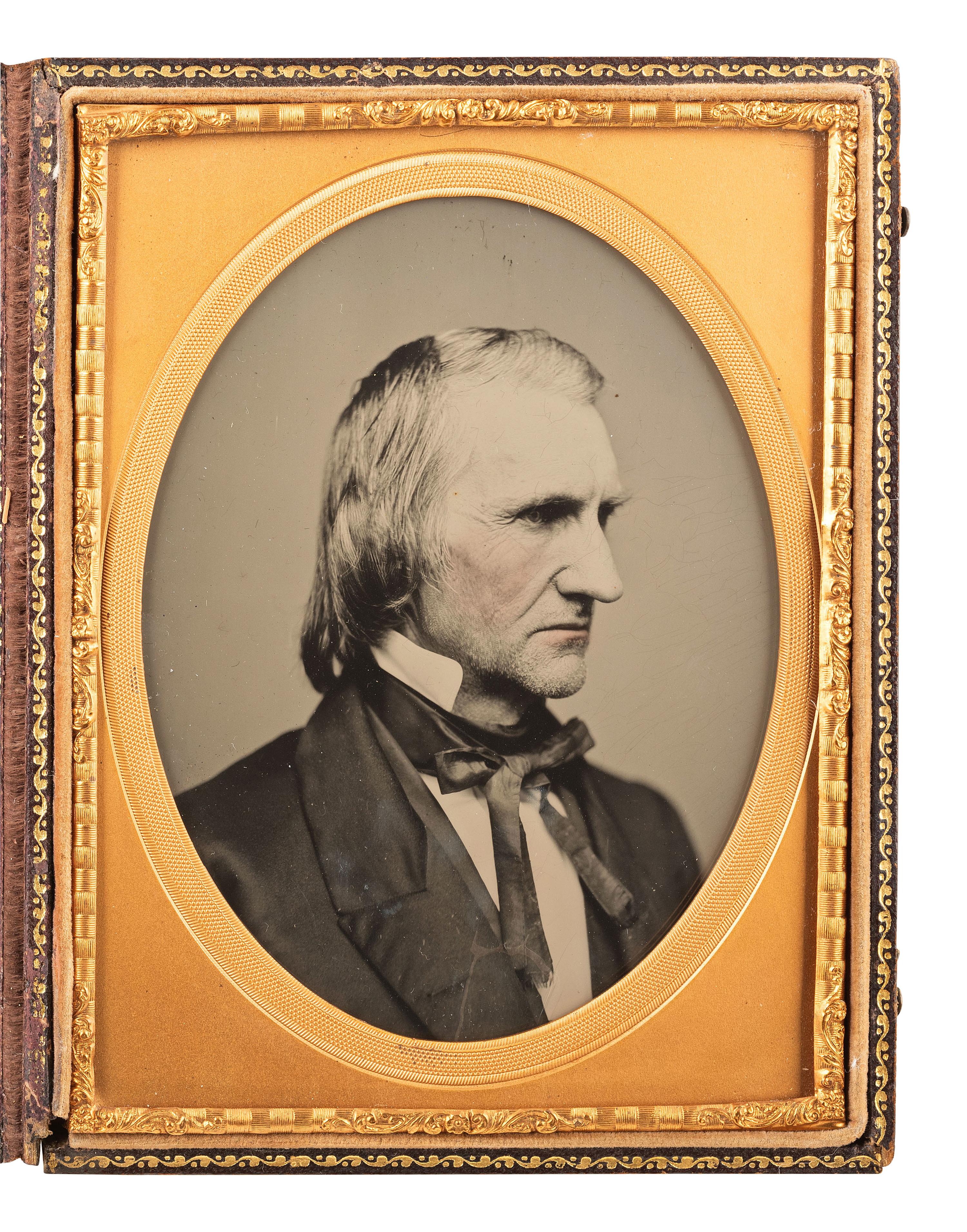 [EARLY PHOTOGRAPHY]. A pair of cased images of serious men, highlighted by an example featuring a man wearing a top hat by Mathew BRADY.