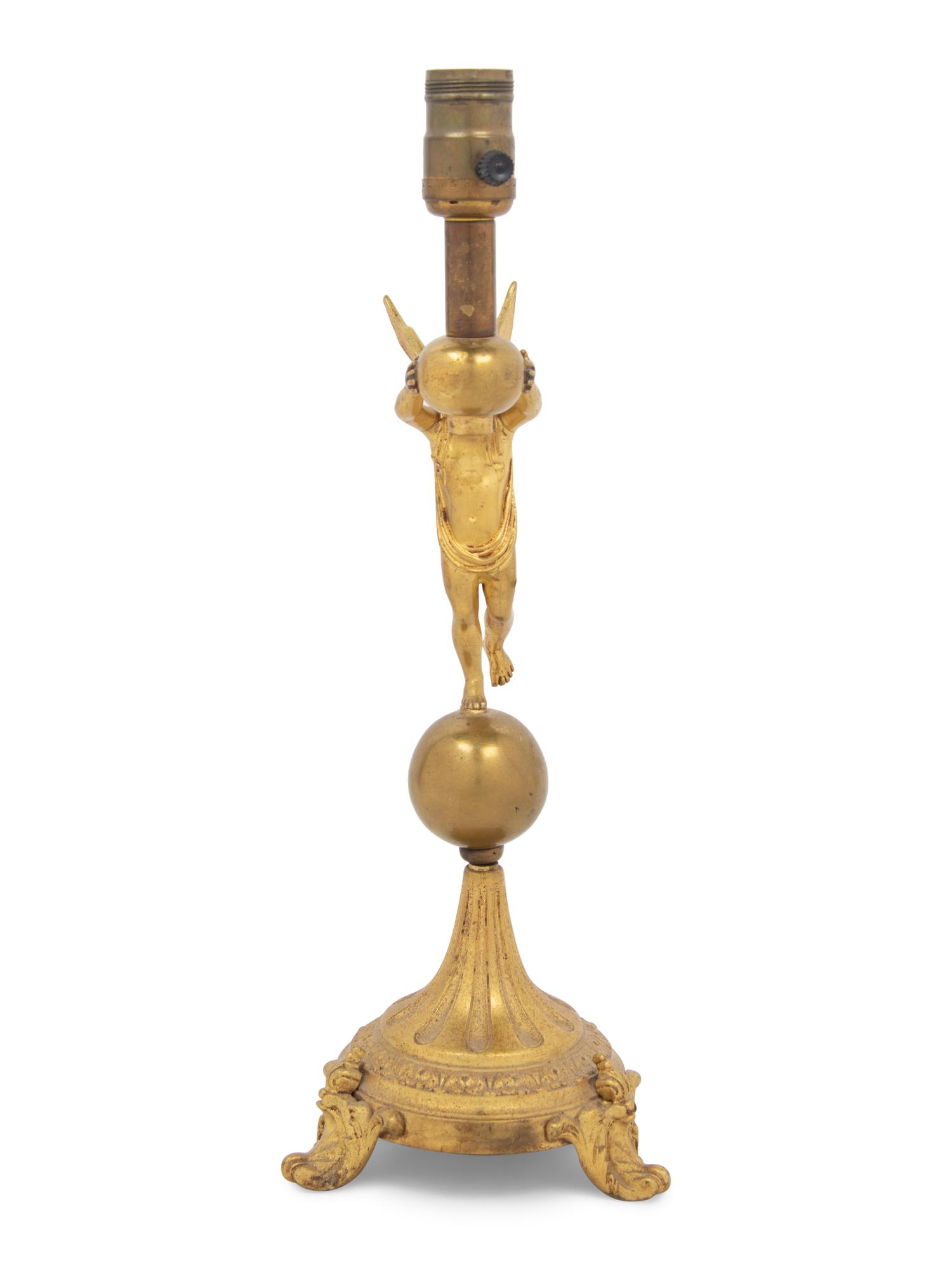 A Continental Gilt Metal Figural Lamp