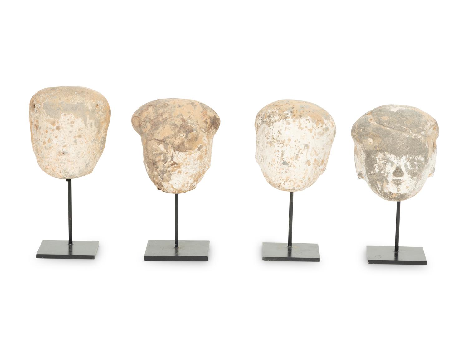 Four Tang Pottery Heads on Stands