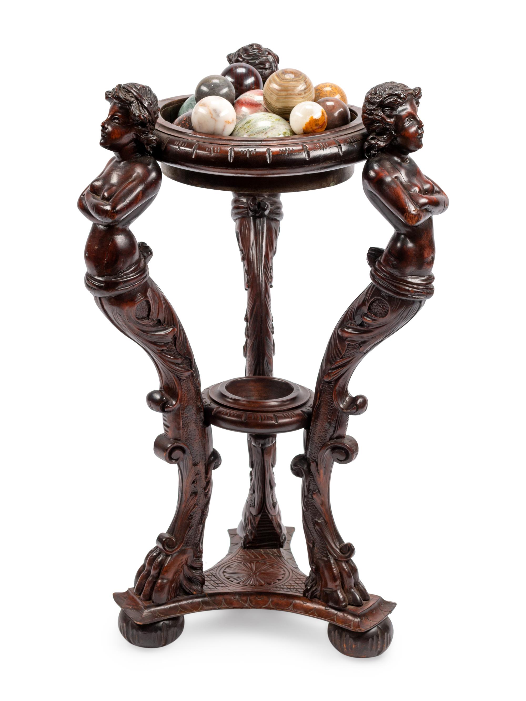 A Continental Carved Wood Jardinière and Fifteen Marble Ornaments