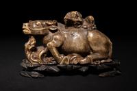 A Pair of Chinese Brown Hardstone 'Ox and Herd' Figural Groups