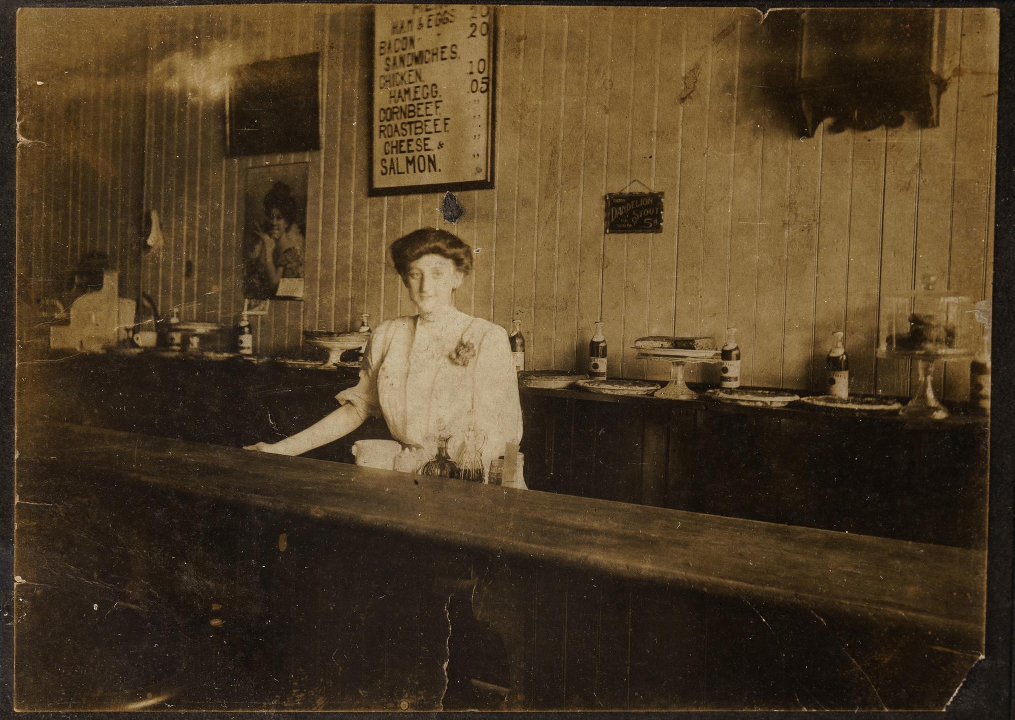 Nine Photographs Depicting Storefronts and Various Interiors