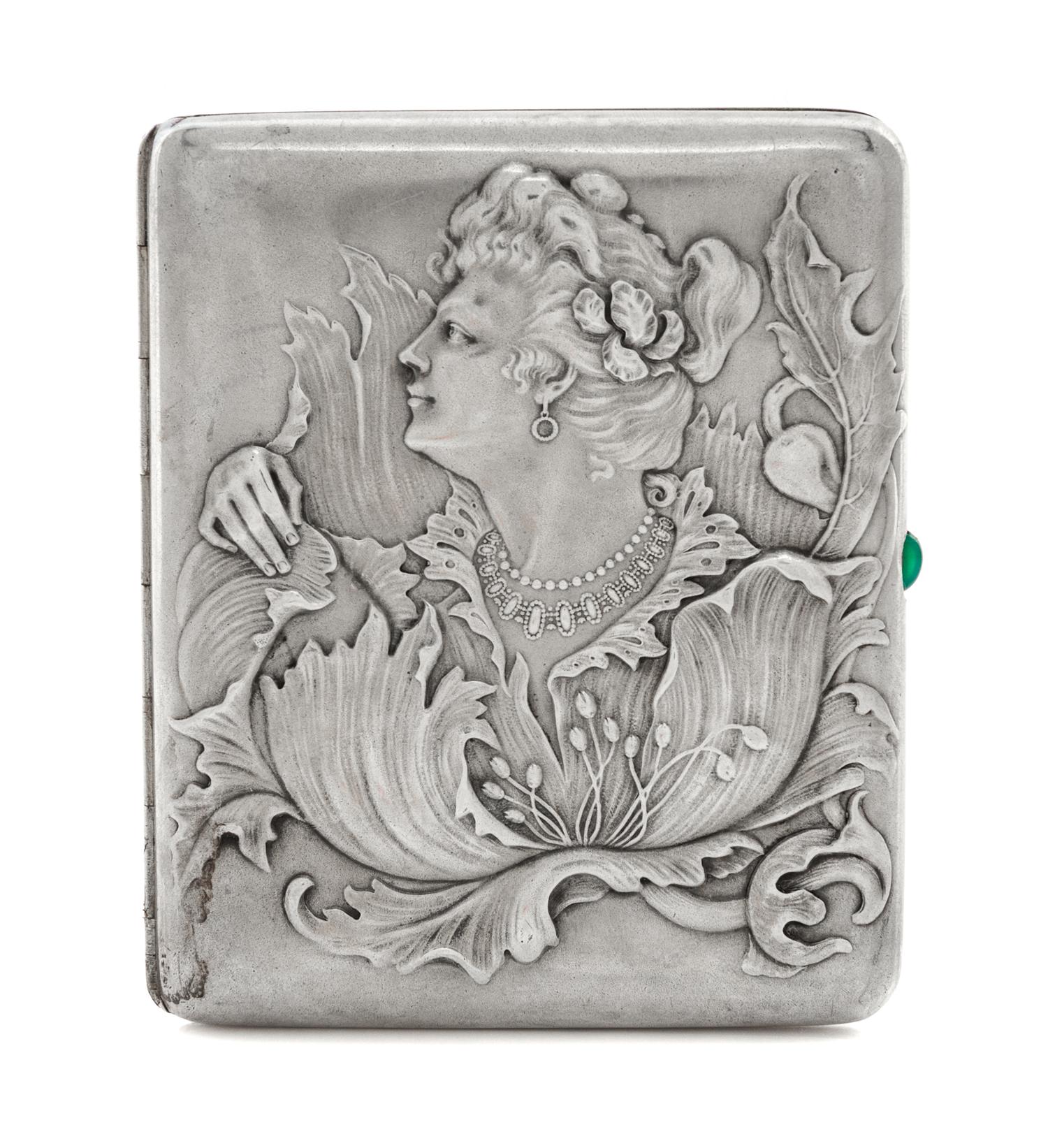 A Russian Silver Cigarette Case, Maker's mark obscured, assay mark of Ivan Lebedkin, Moscow, the lid with raised decoration showing a w