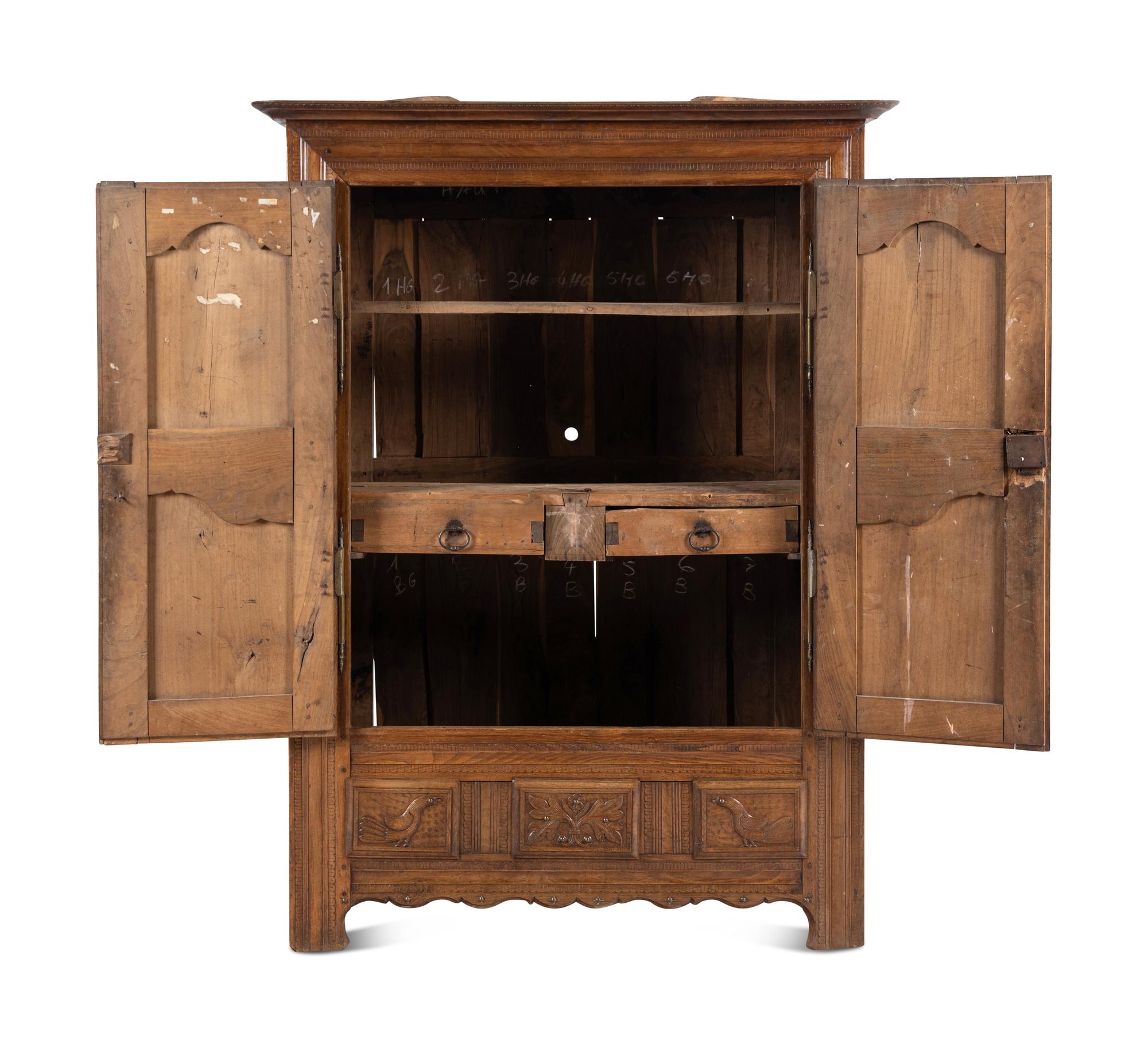 A French Carved Walnut Armoire