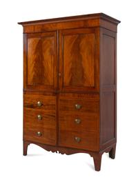 A Regency Mahogany Armoire Simulating a Linen Press