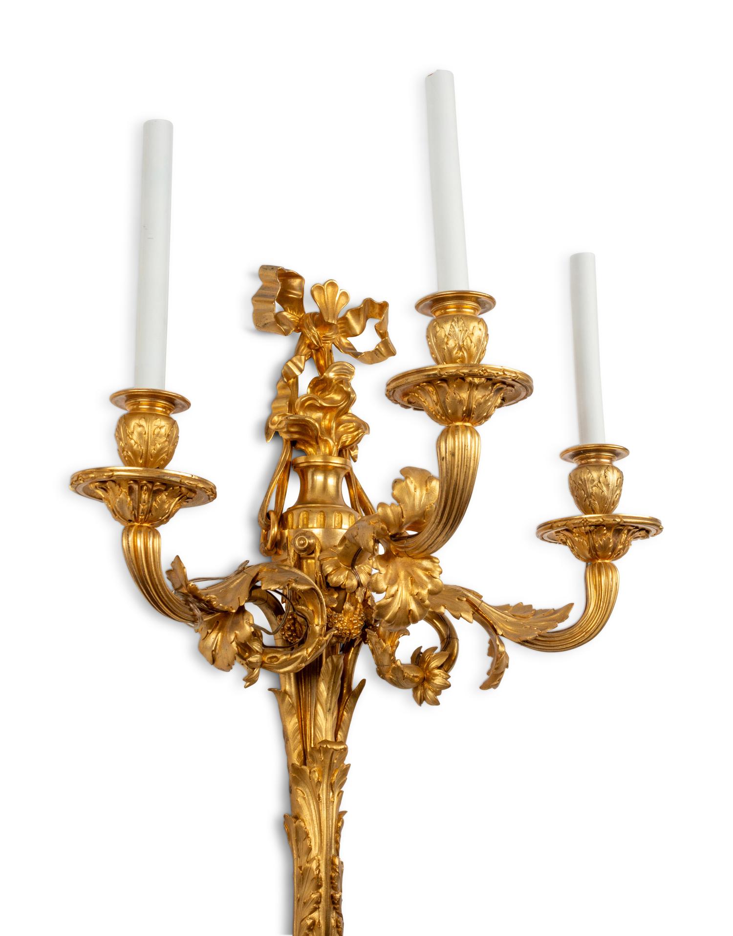 A Pair of Louis XVI Style Gilt Bronze Three-Light Sconces