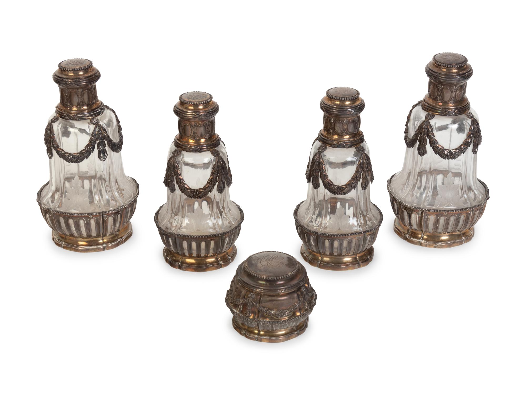 A Group of Four French Silver-Mounted Cut Glass Decanters
