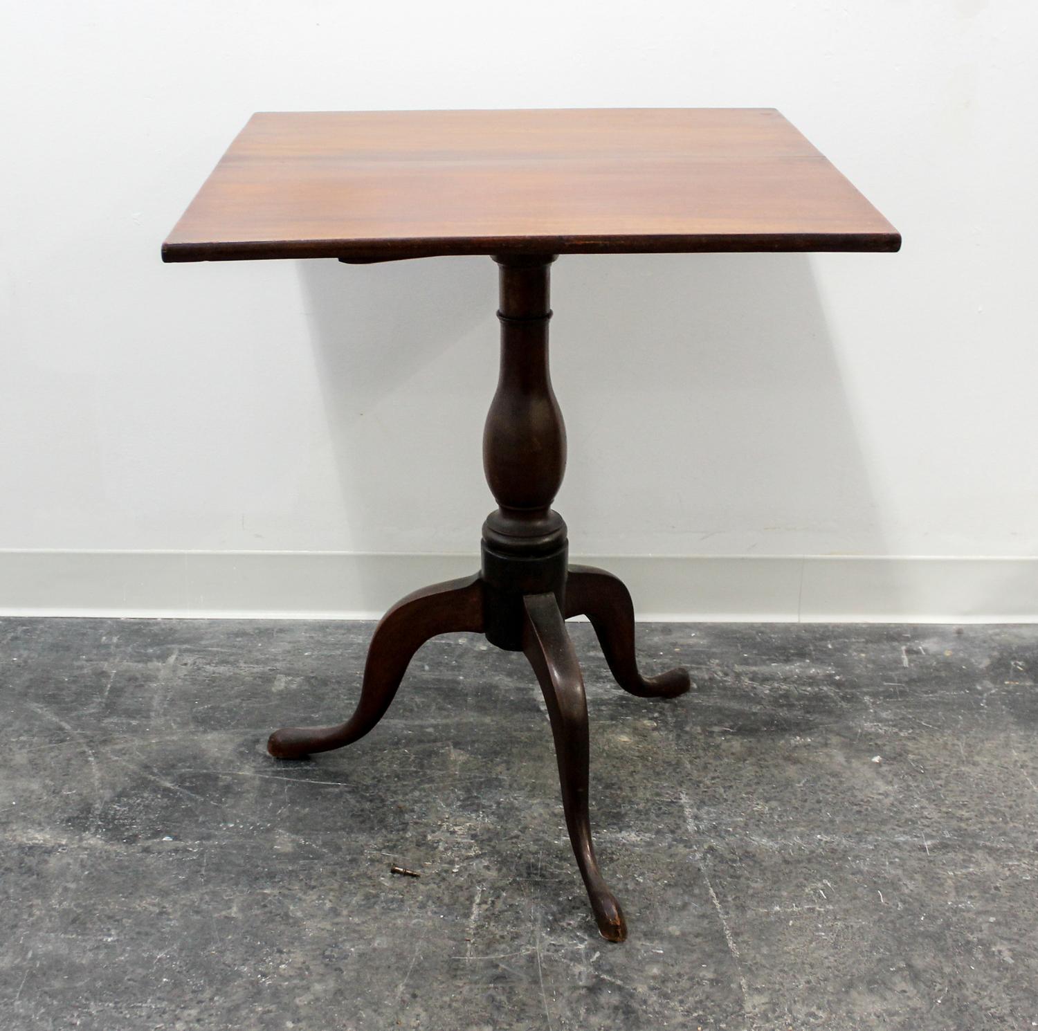 An American Walnut Tilt-top Table Height 47 inches.