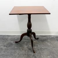 An American Walnut Tilt-top Table Height 47 inches.