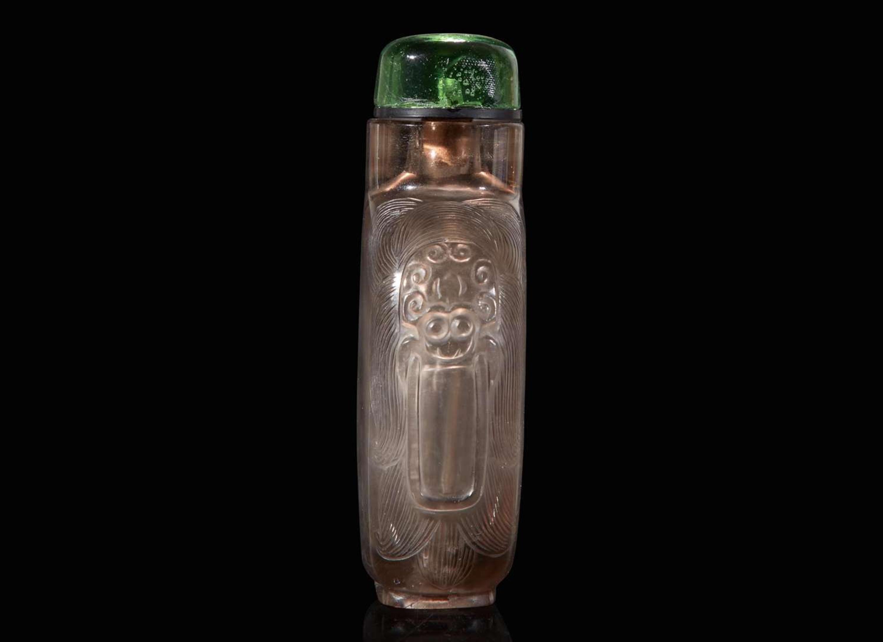 A Chinese carved smoky quartz snuff bottle and a jadeite snuff bottle 煙晶石及翡翠鼻煙壺各一只