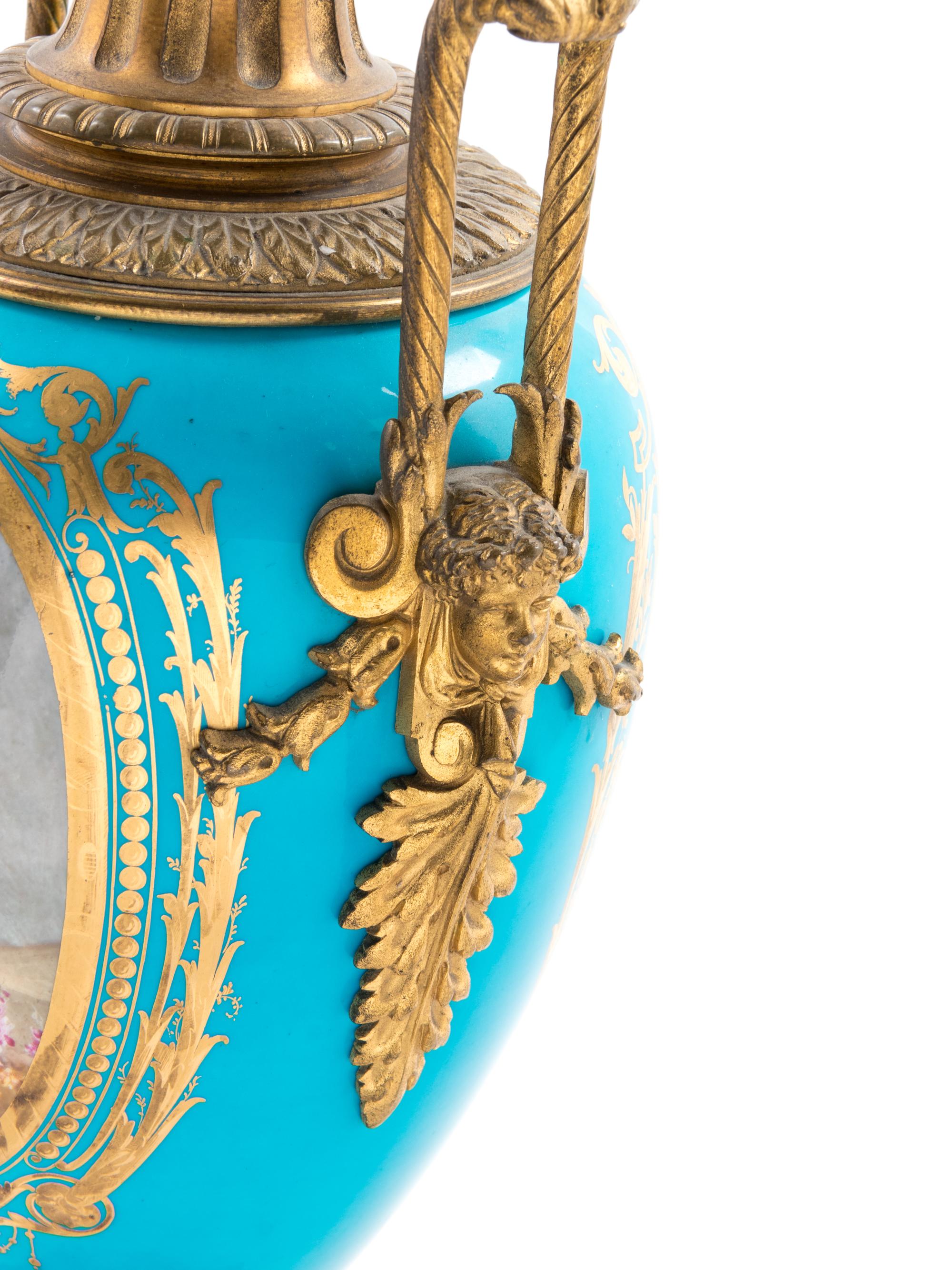 A Sèvres Style Gilt Bronze Mounted Painted and Parcel Gilt Celeste-Blue Ground Porcelain Seven-Light Candelabrum