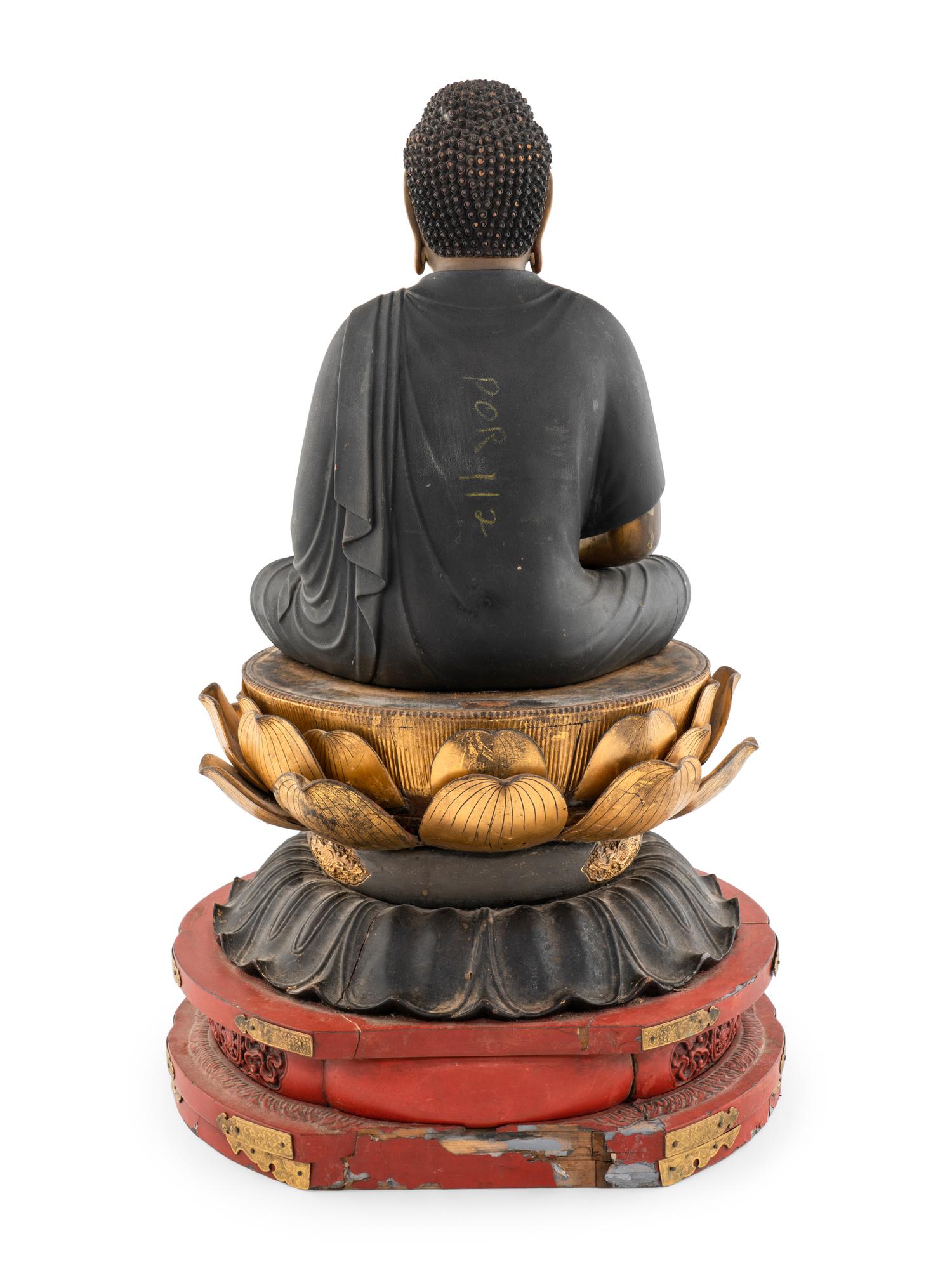 A Japanese Gilt and Red Lacquered Wood Figure of Buddha