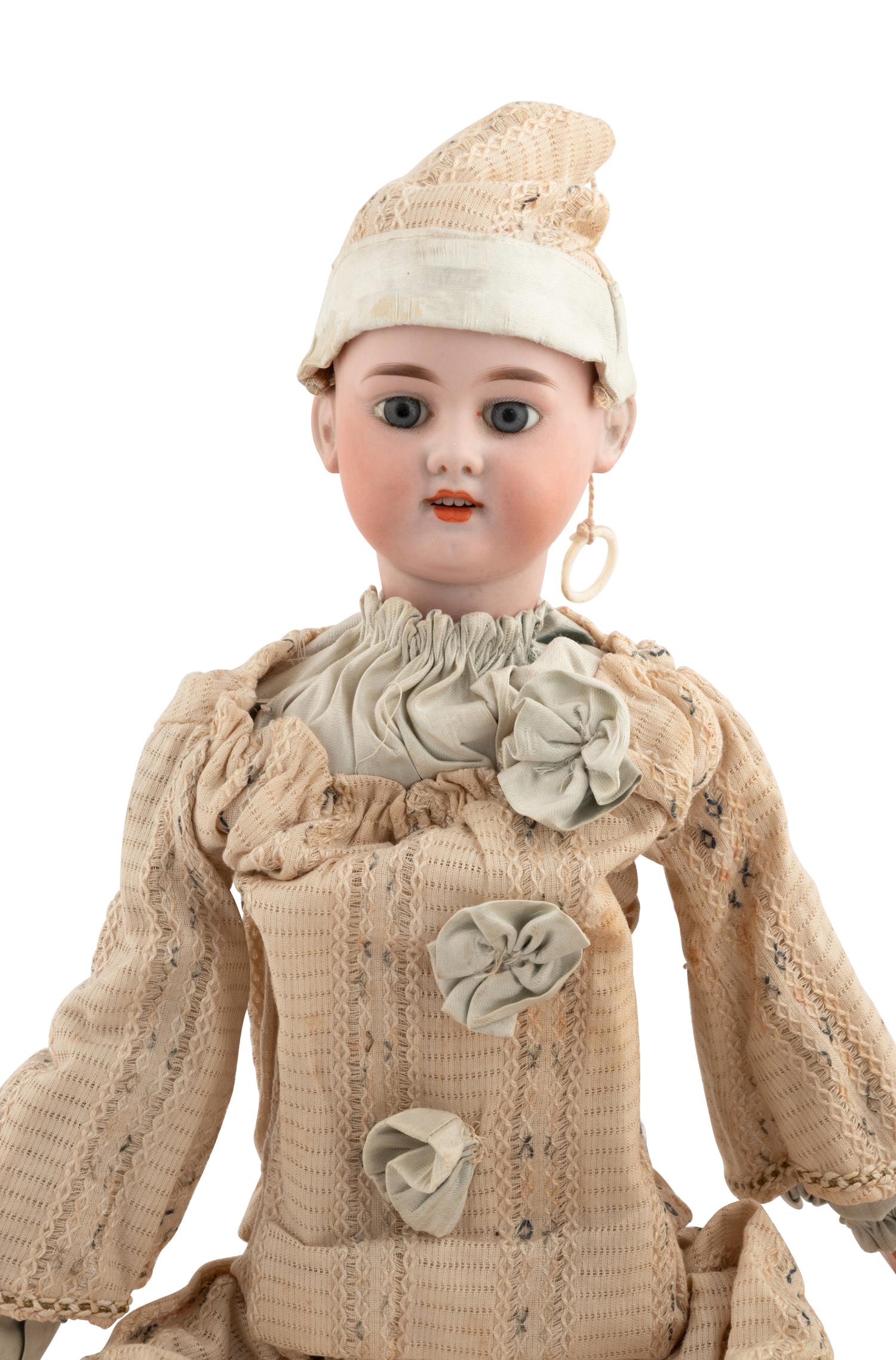 A Group of Squeezer Dolls and Other Toys