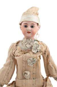 A Group of Squeezer Dolls and Other Toys
