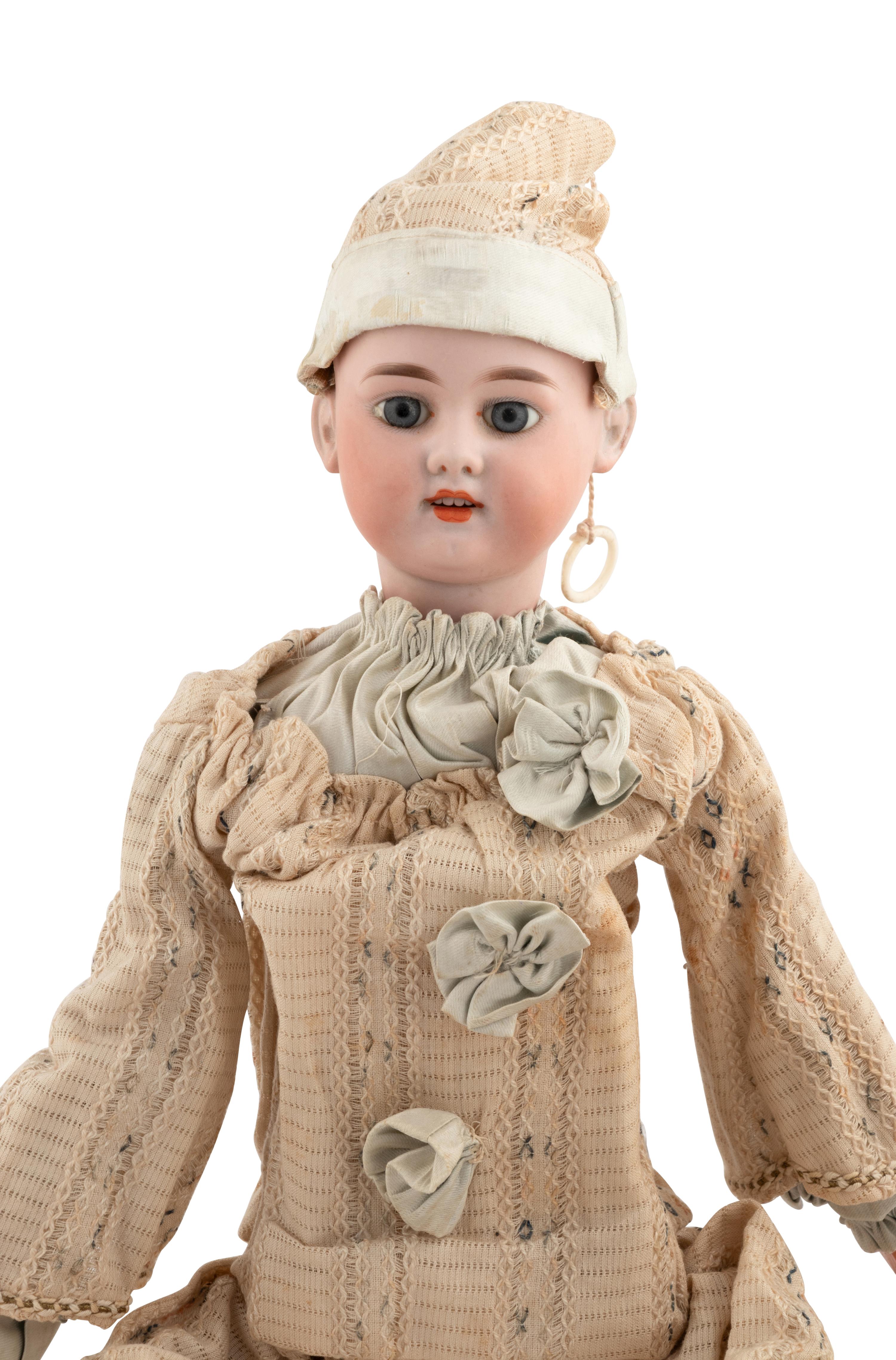 A Group of Squeezer Dolls and Other Toys
