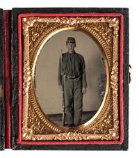 [CIVIL WAR]. Ninth plate ruby ambrotype portrait of a young, armed Confederate private.
