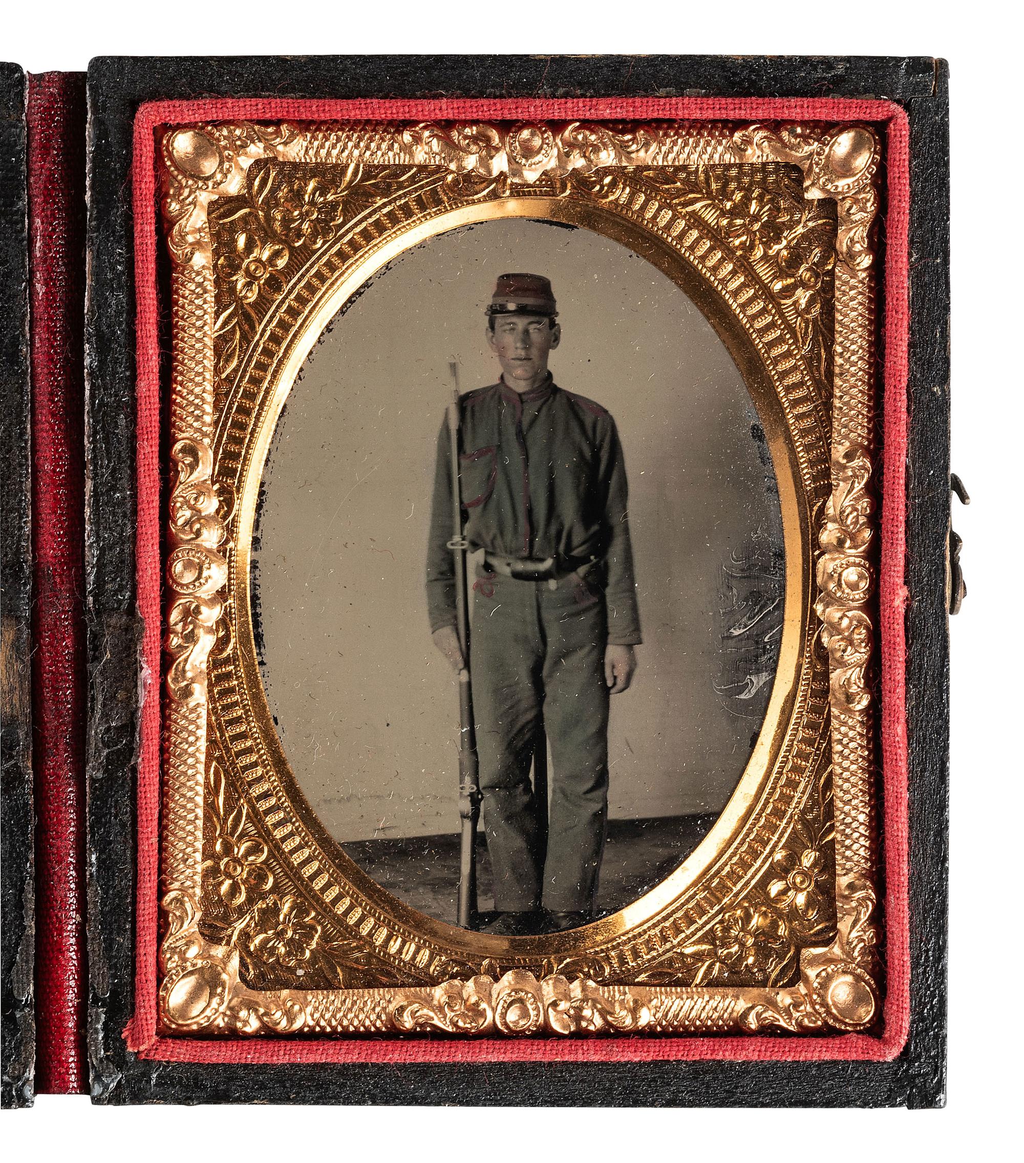 [CIVIL WAR]. Ninth plate ruby ambrotype portrait of a young, armed Confederate private.