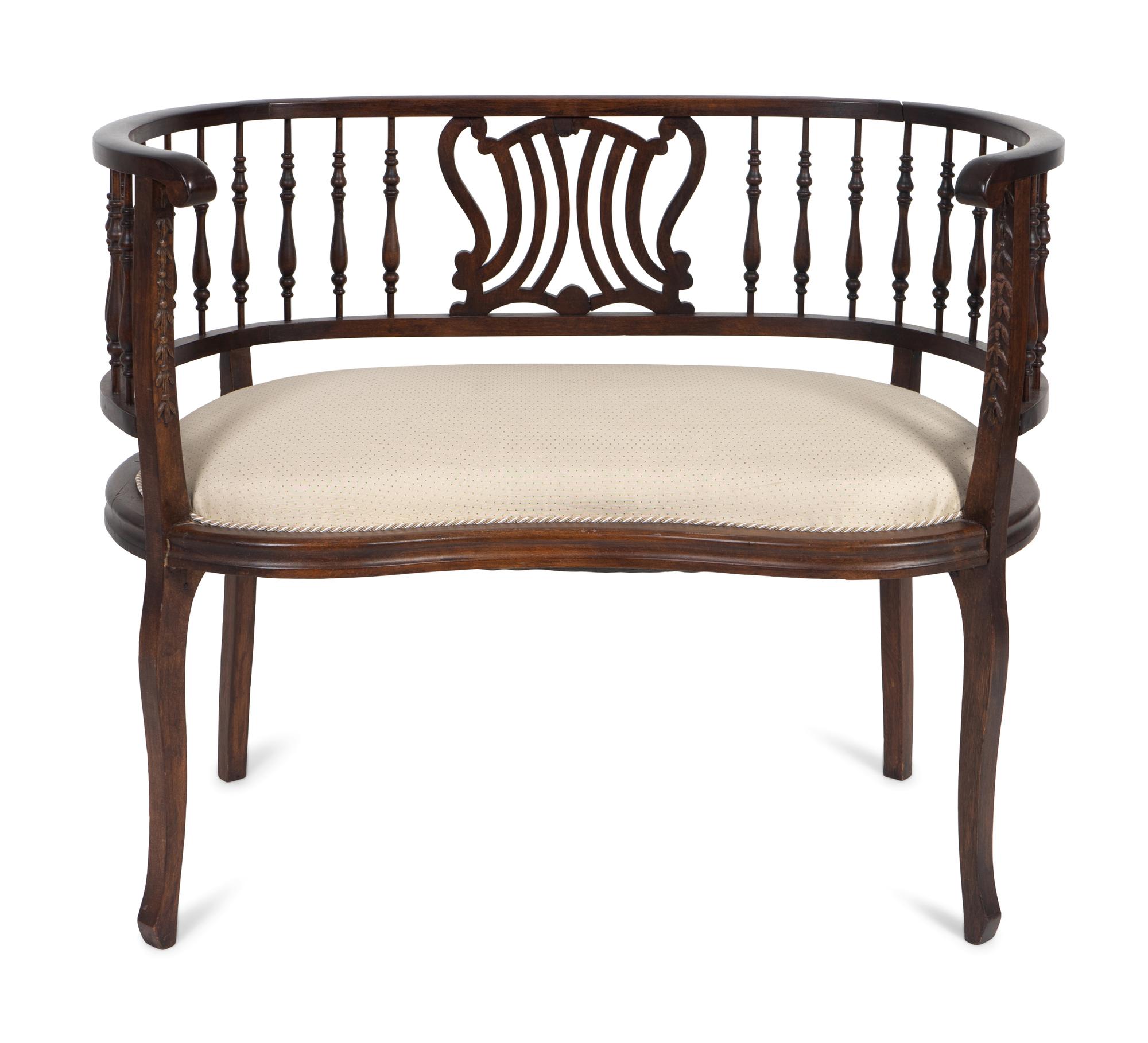 An Edwardian Mahogany Settee — EARLY 20TH CENTURY