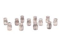 A Group of Sixteen Silver Casters