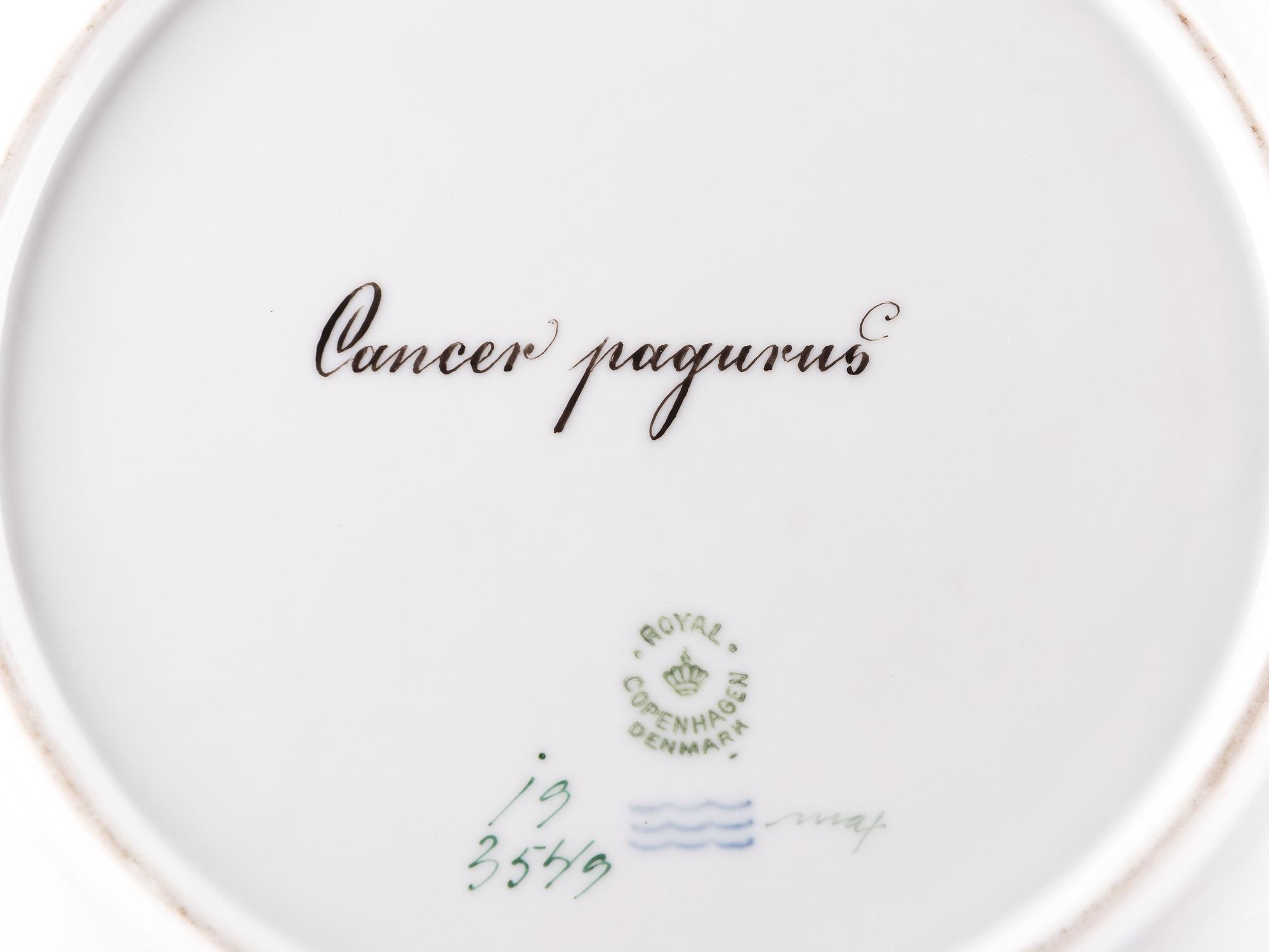 A Set of Twelve Royal Copenhagen Parcel Gilt Porcelain Fish Plates
