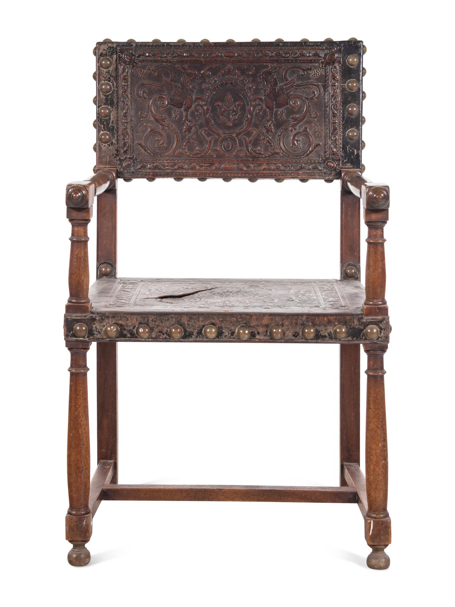 A Spanish Baroque Leather-Upholstered Walnut Armchair