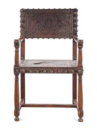 A Spanish Baroque Leather-Upholstered Walnut Armchair