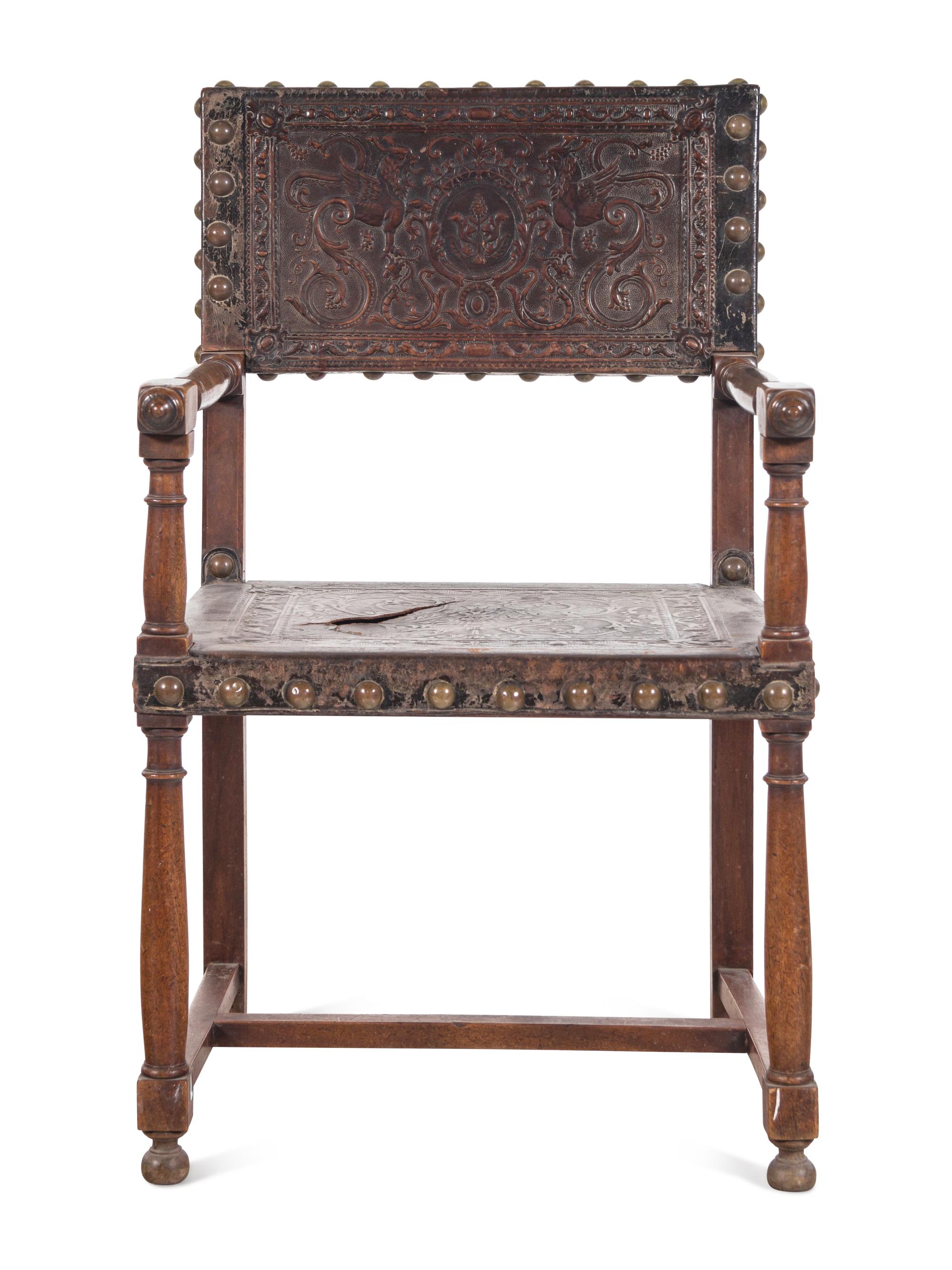 A Spanish Baroque Leather-Upholstered Walnut Armchair