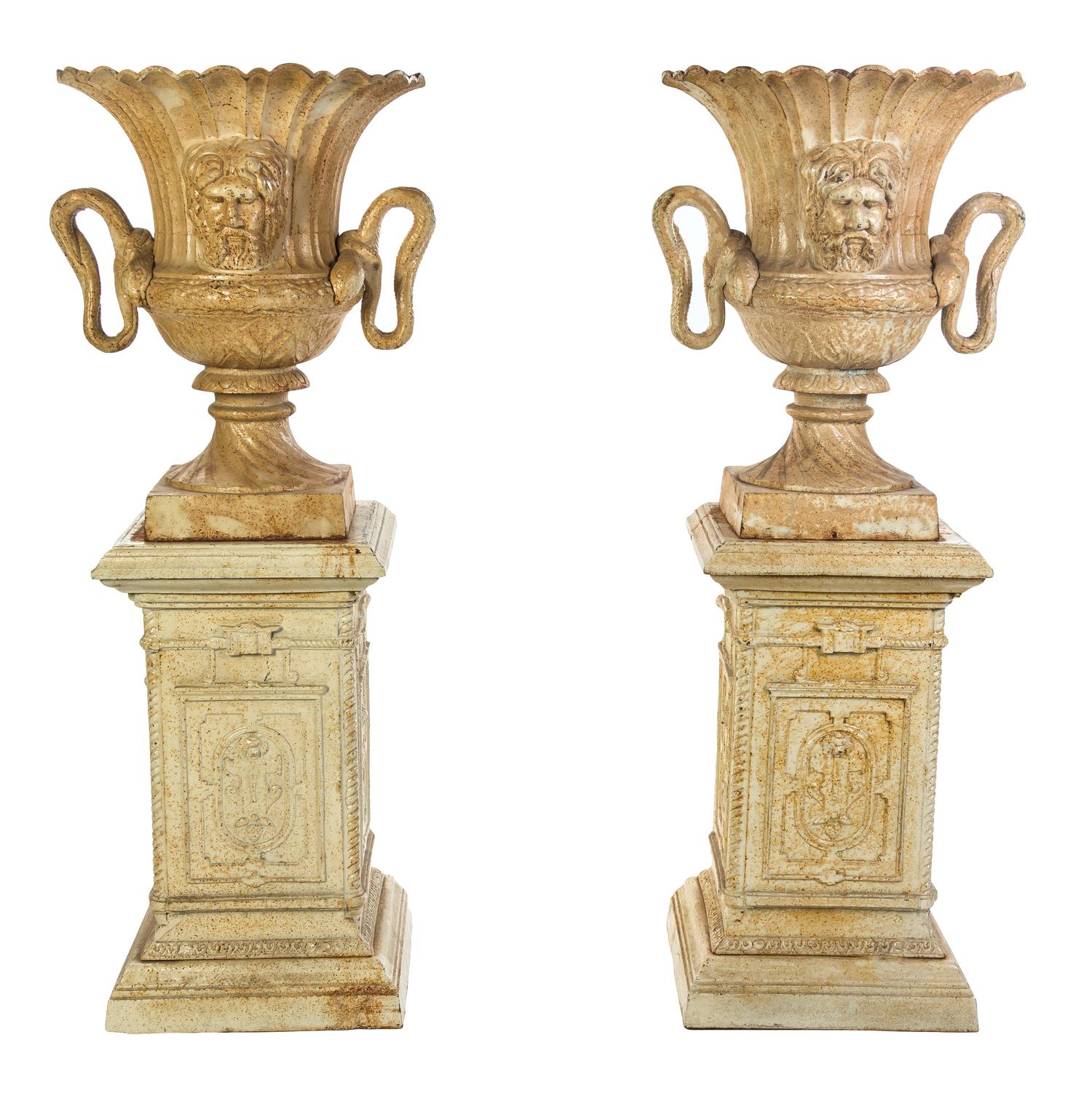 A Pair of Victorian Style Cast Iron Urns, Height overall 61 1/4 inches.