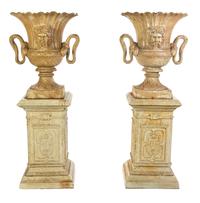 A Pair of Victorian Style Cast Iron Urns, Height overall 61 1/4 inches.
