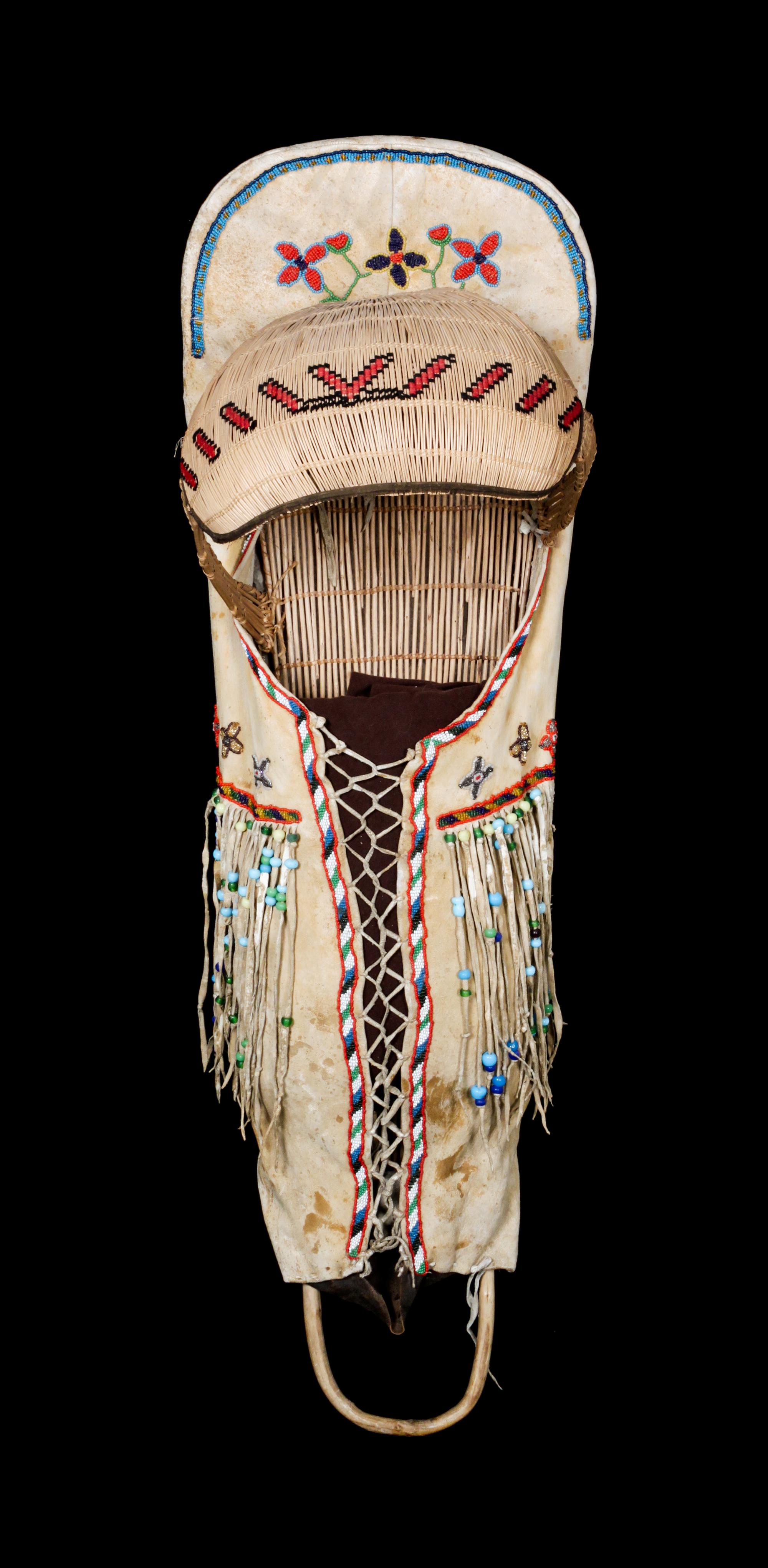 A Paiute Hide and Beaded Cradle Board Length 39 x width 12 inches. — LATE 19TH/ EARLY 20TH CENTURY