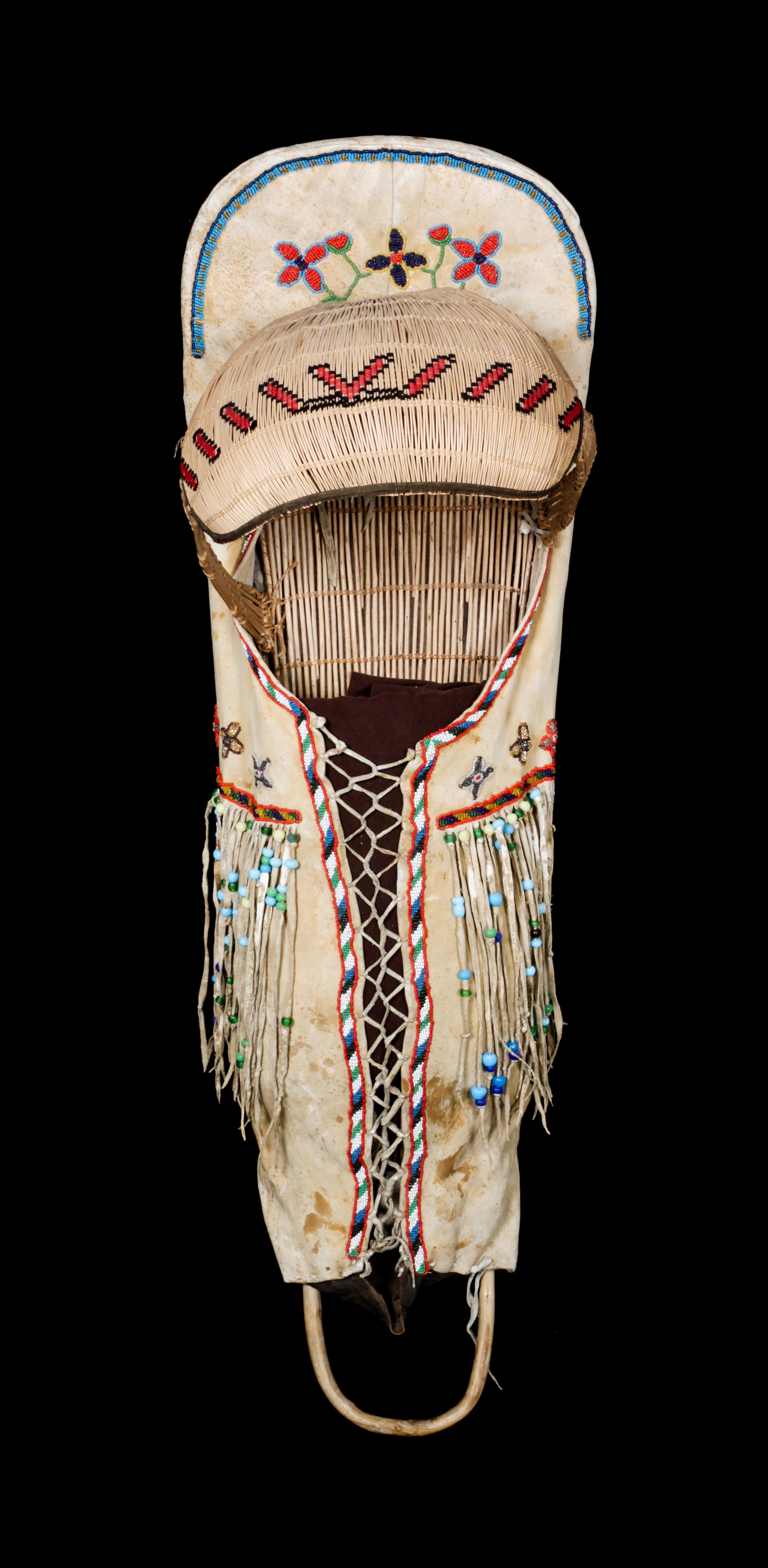 A Paiute Hide and Beaded Cradle Board Length 39 x width 12 inches. — LATE 19TH/ EARLY 20TH CENTURY