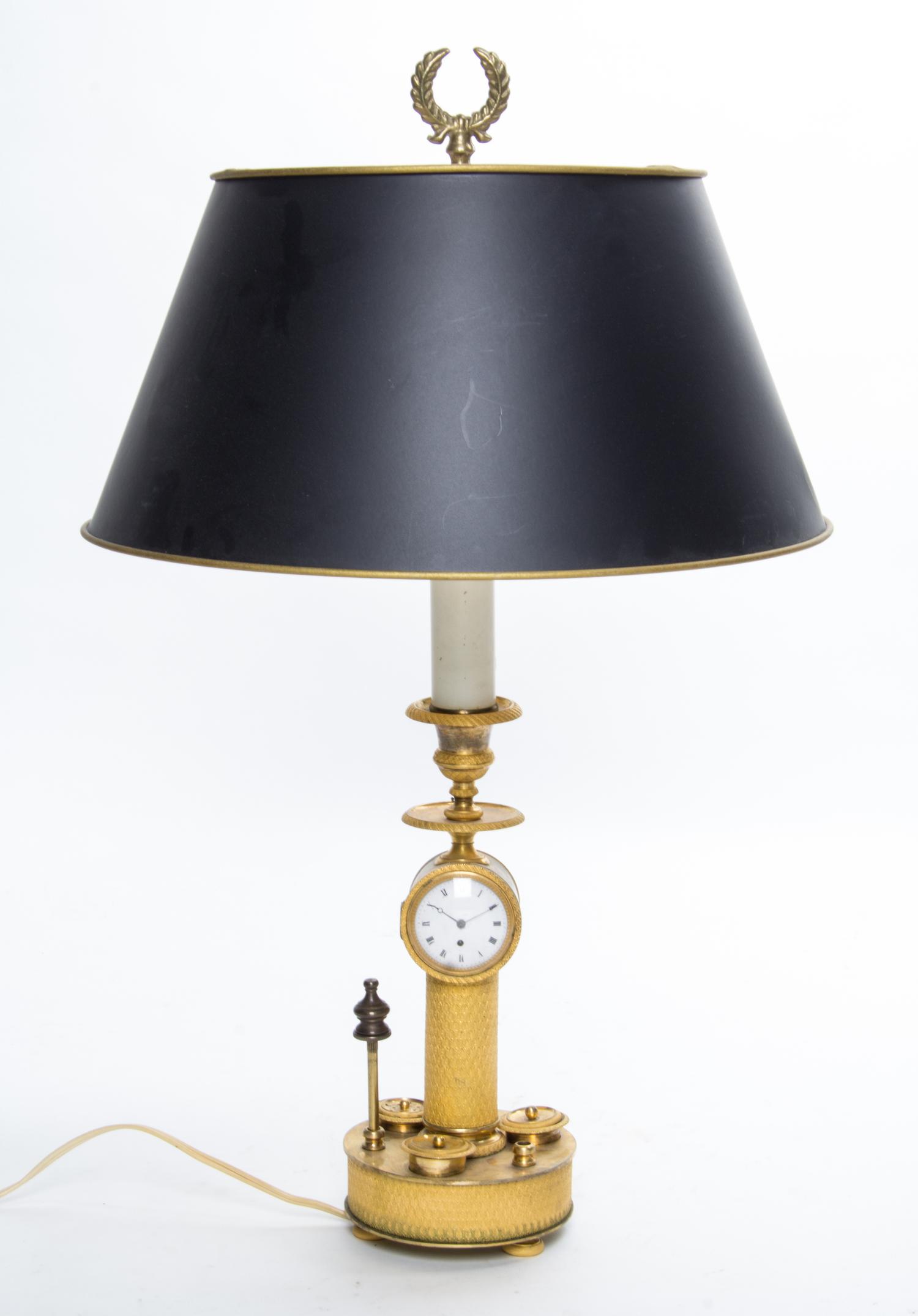 An Empire Gilt Bronze Candlestick Clock Height overall 20 inches. — 19TH CENTURY