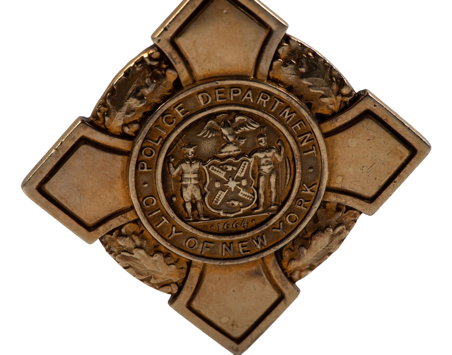 [OCCUPATIONAL]. National Surety Medal for Valor presented to African American police officer Leslie H. Carroll. New York: Tiffany & Co., 1943.