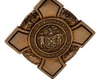 [OCCUPATIONAL]. National Surety Medal for Valor presented to African American police officer Leslie H. Carroll. New York: Tiffany & Co., 1943.