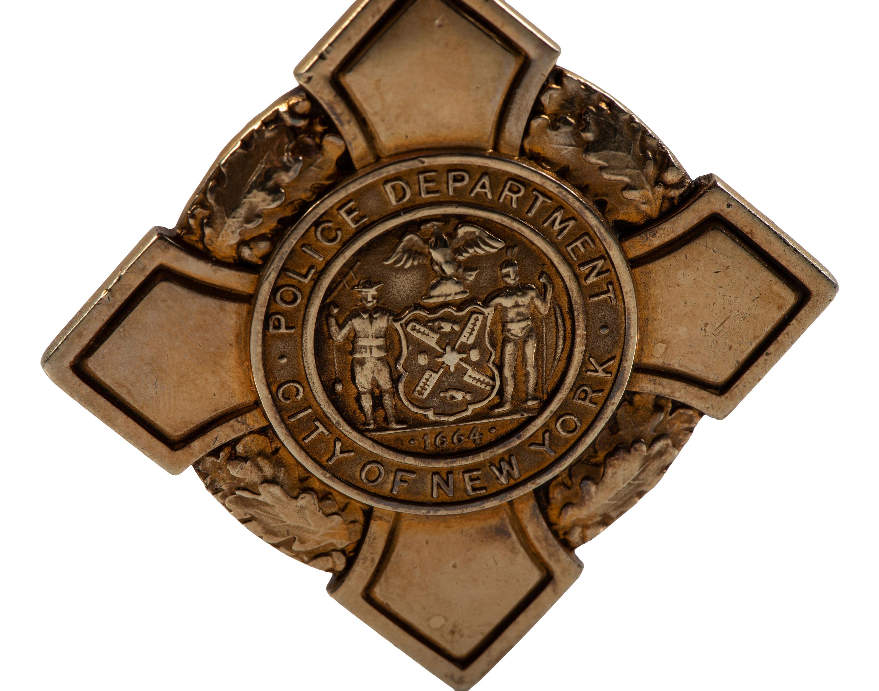 [OCCUPATIONAL]. National Surety Medal for Valor presented to African American police officer Leslie H. Carroll. New York: Tiffany & Co., 1943.
