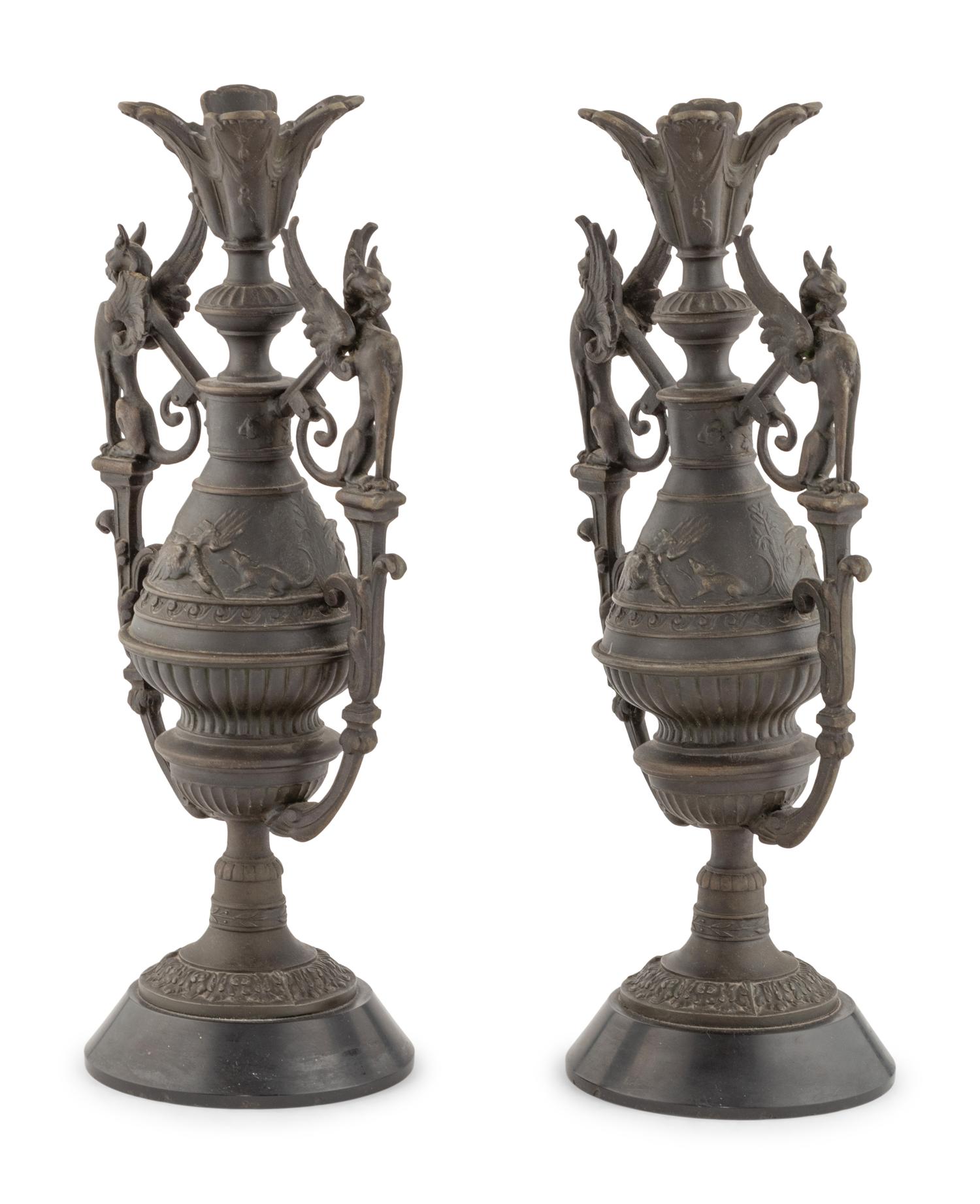 A Pair of Neoclassical Cast Metal Candlesticks