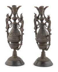 A Pair of Neoclassical Cast Metal Candlesticks