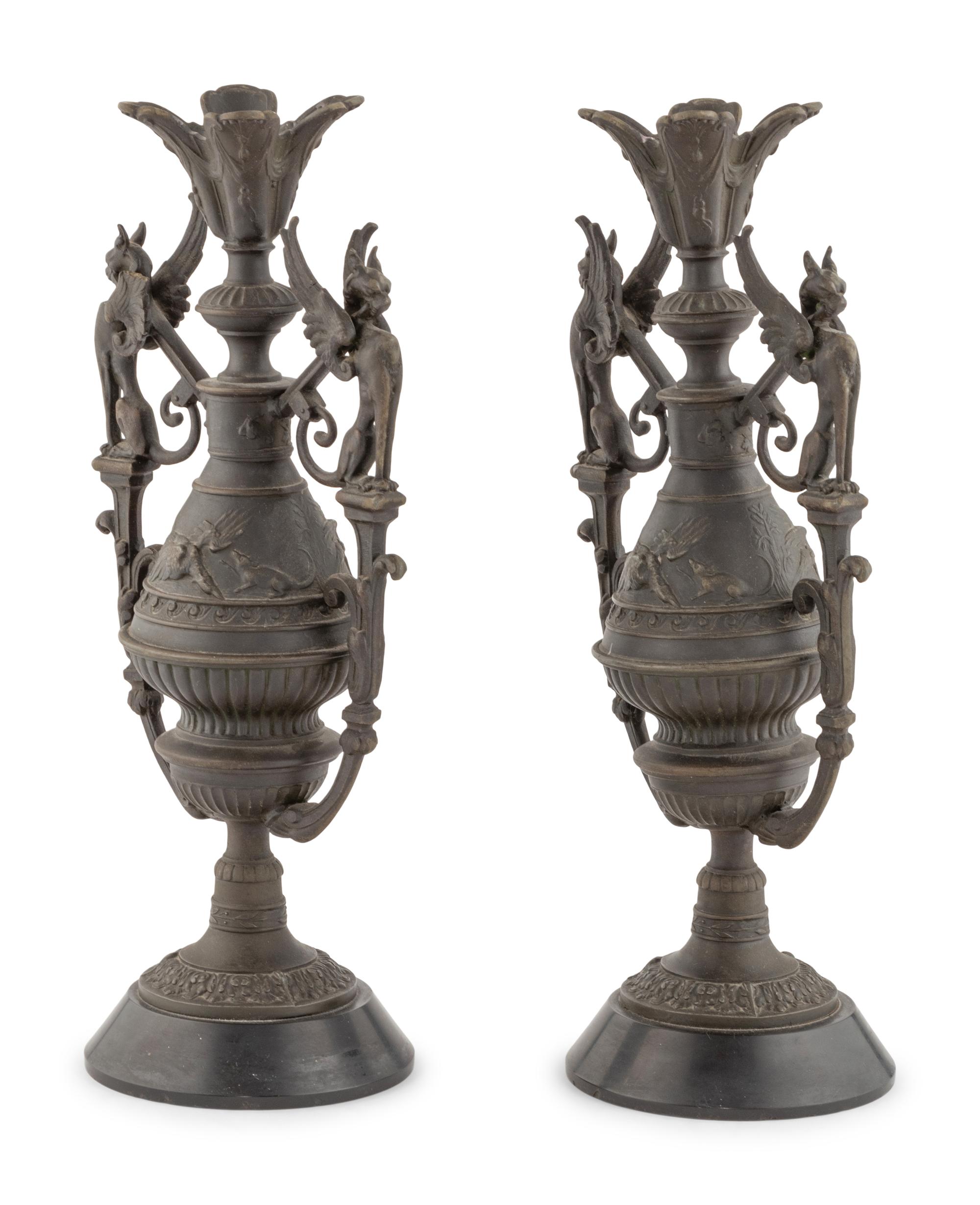 A Pair of Neoclassical Cast Metal Candlesticks