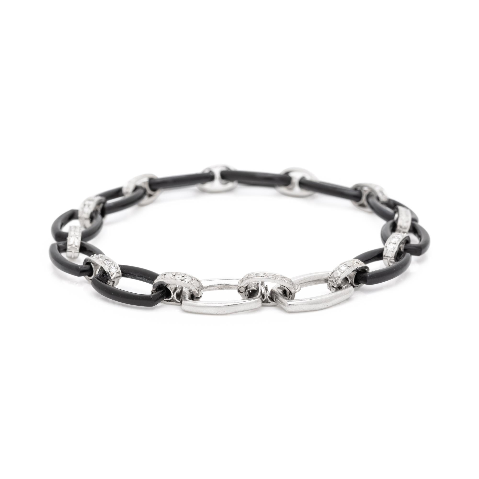 ART DECO, PLATINUM, ONYX AND DIAMOND BRACELET