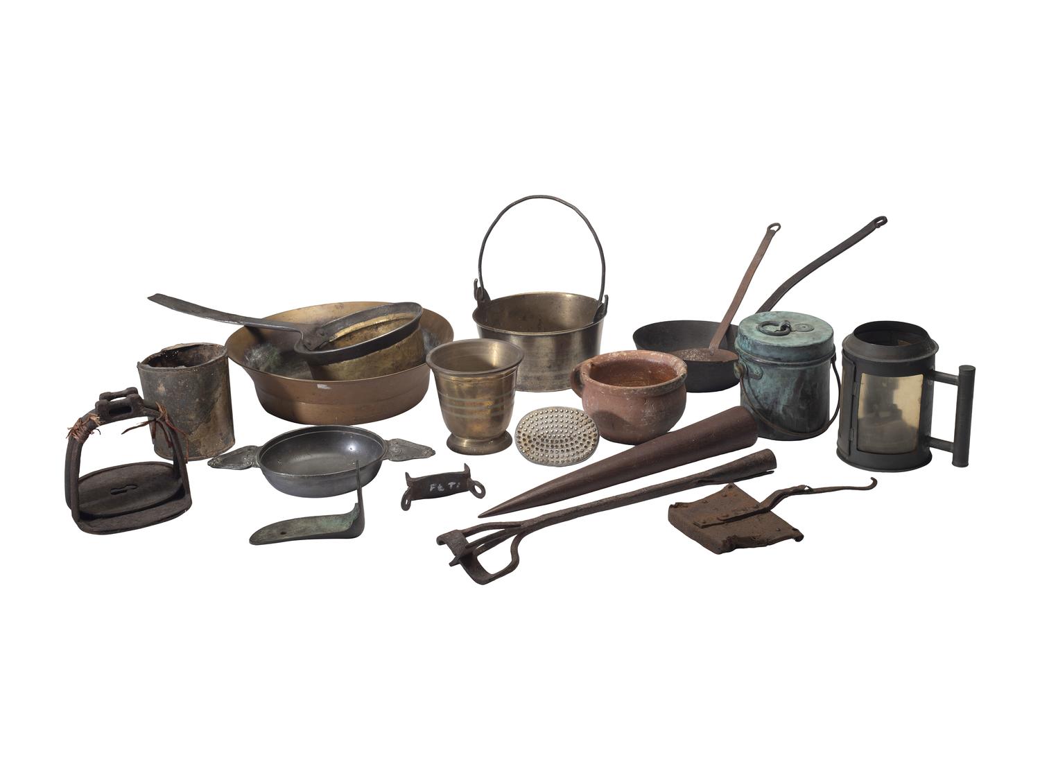 [CAMP LIFE]. A group of branding irons, utensils, and other camp tools.