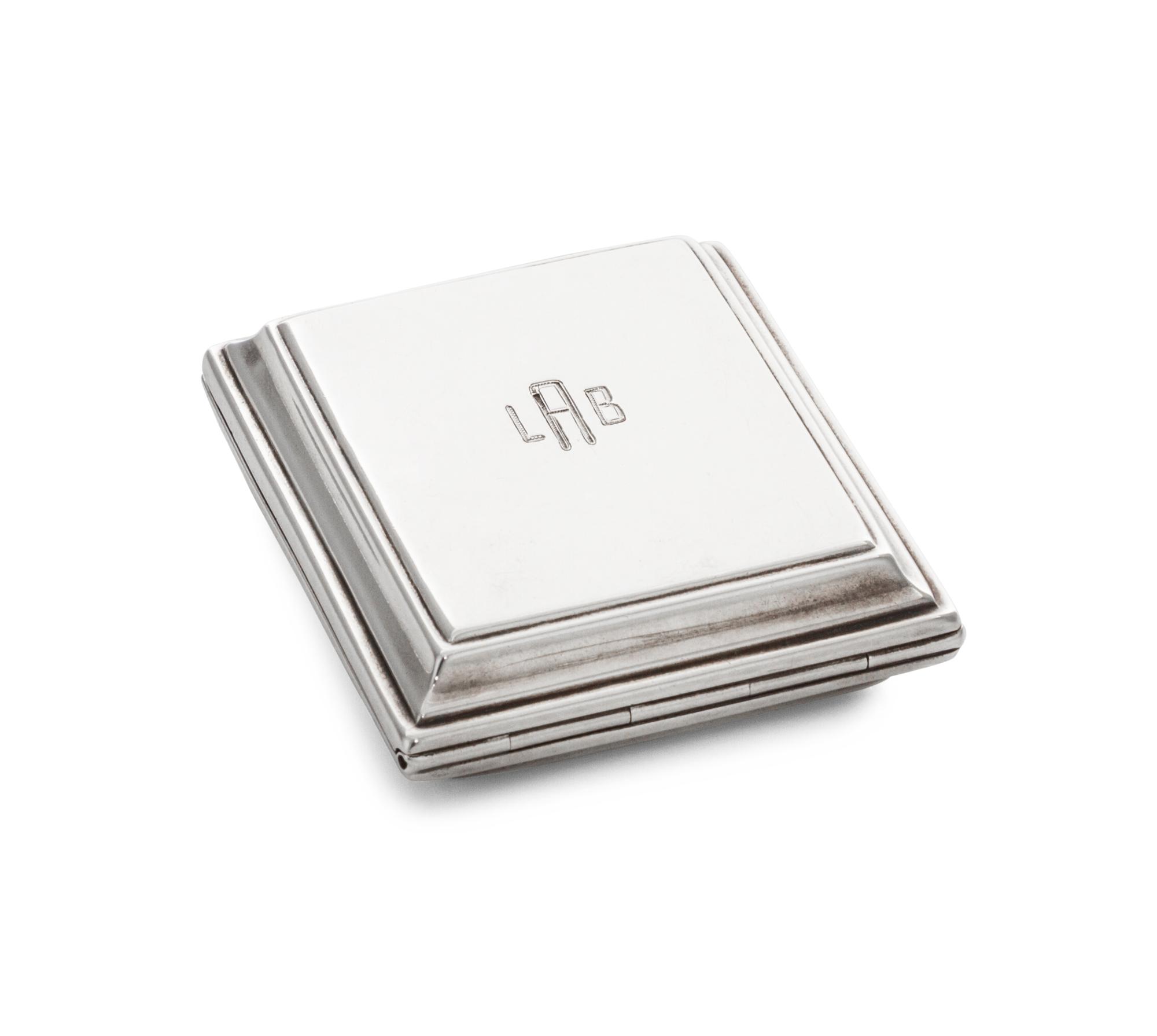 An American Silver Travel Clock, Tiffany & Co., New York, NY, Circa 1920s, of rectangular form with spot-hammered surfaces, the exterio