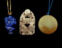 Three Chinese Jade and Hardstone Pendants