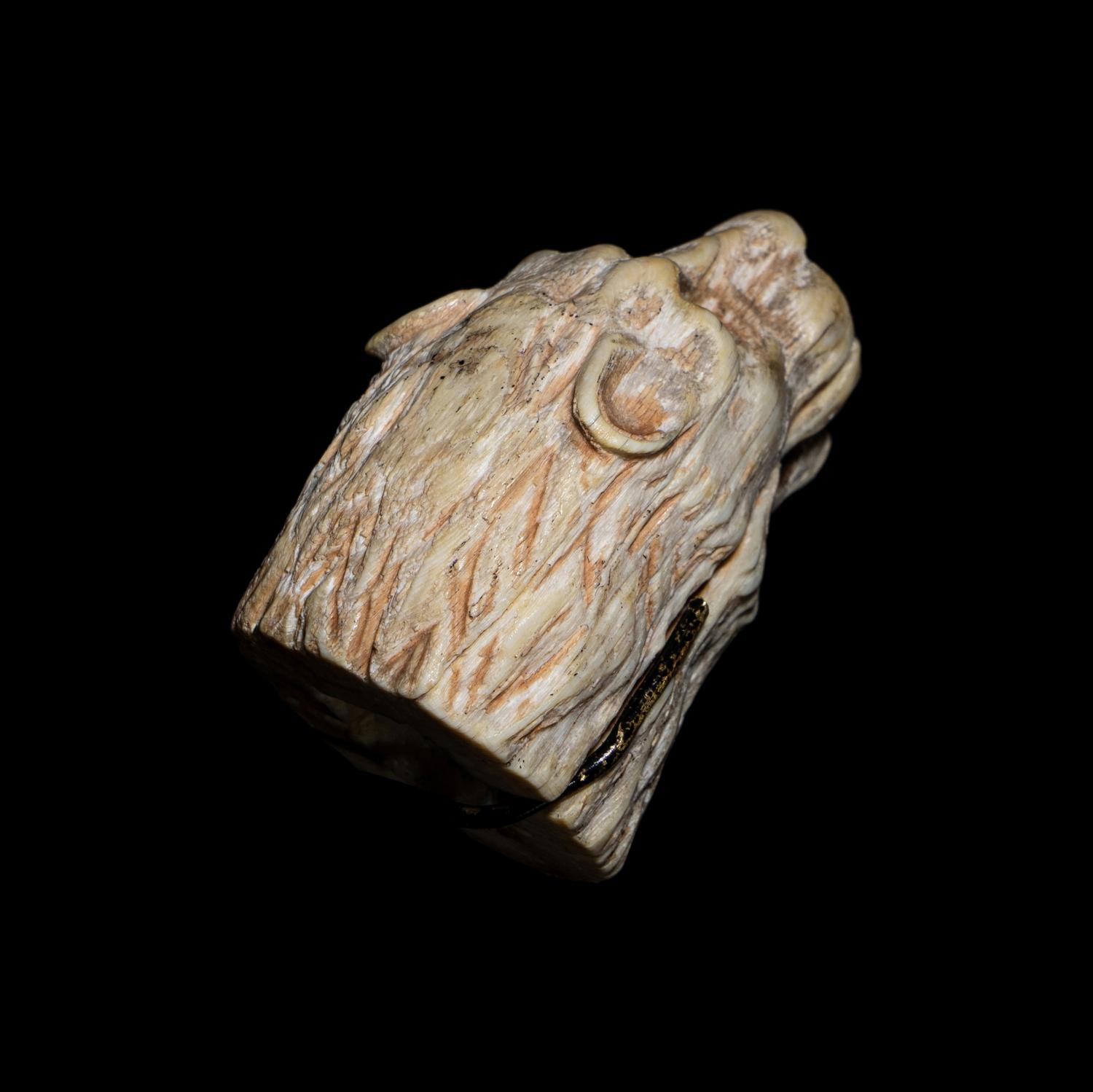 An Egyptian Bone Head of a Lion