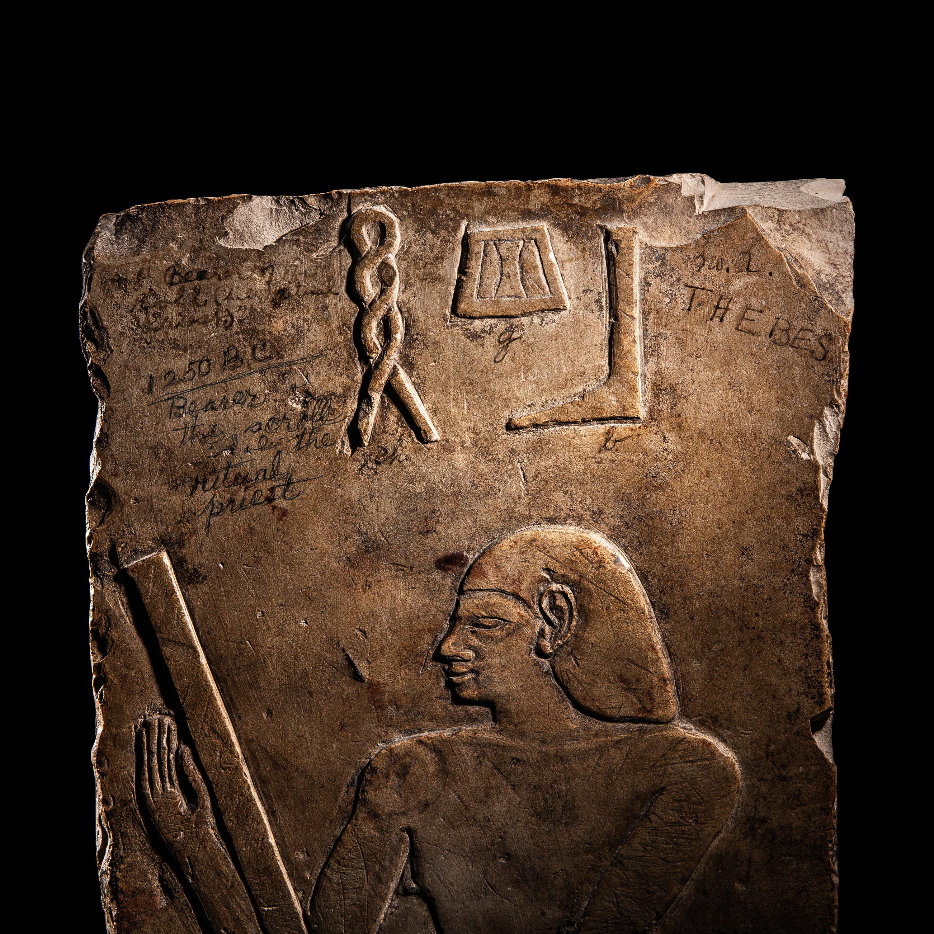 An Egyptian Limestone Relief Fragment with a Priest