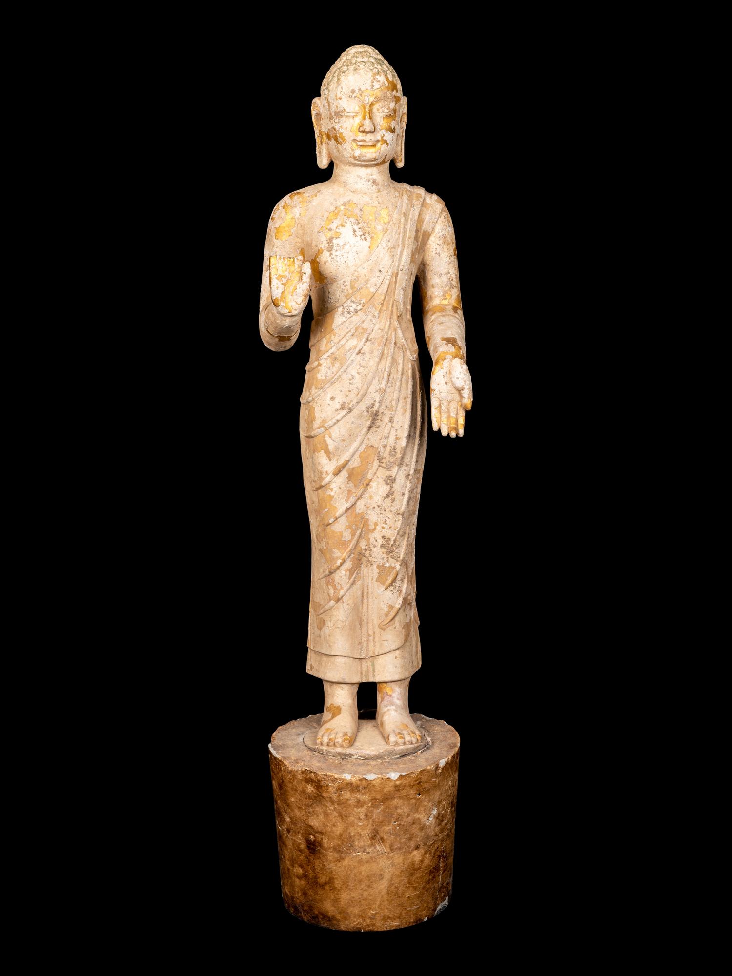 A Chinese Carved Stone Standing Draped Guanyin Figure with Remnants of Gilt on Surface