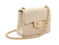 A Chanel Cream Calfskin Leather Small Flap Handbag, 6.5" x 5.5" x 2.5".